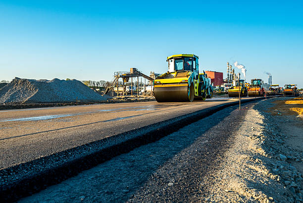 Large view on the road rollers working on the new road construction site